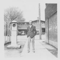 Mr. Blackburn behind the Jr. High Wing of old school (on right), with Vine City Dairy Bar in background. Photo submitted by a 1953, sixth-grade student of Mr. Blackburn.